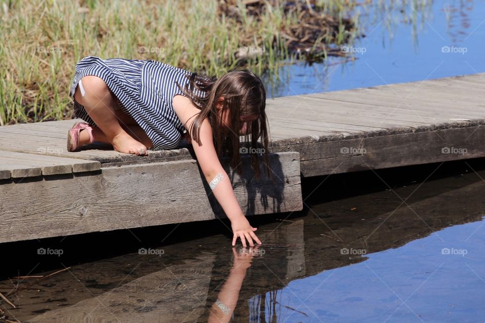 Fingers on the water. 