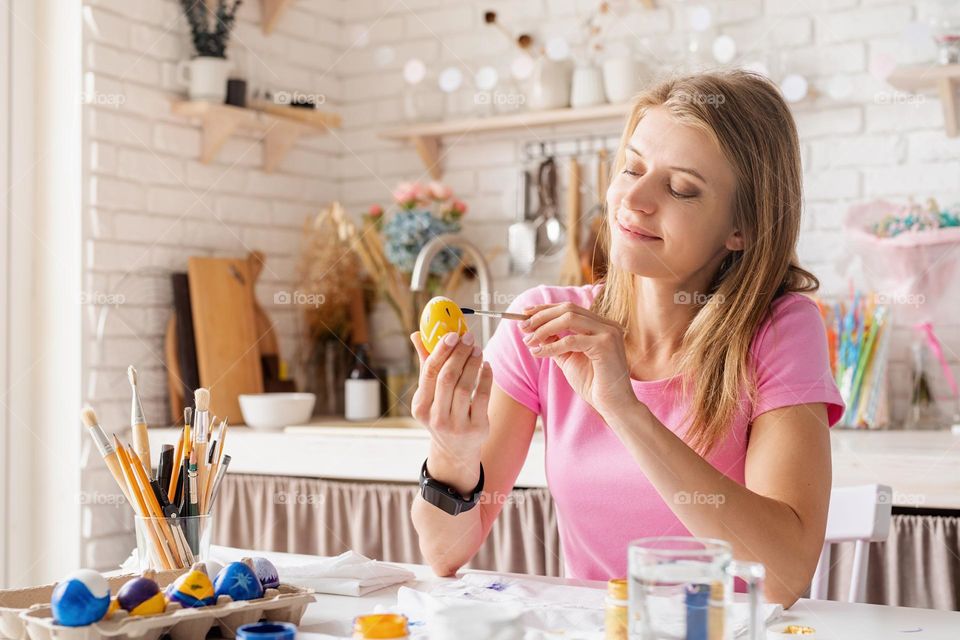 woman coloring eggs