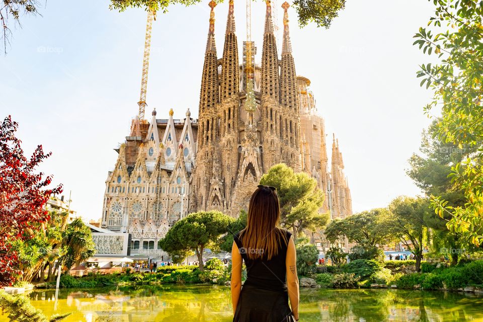 Rear view of a woman looking at Sagrada Familia