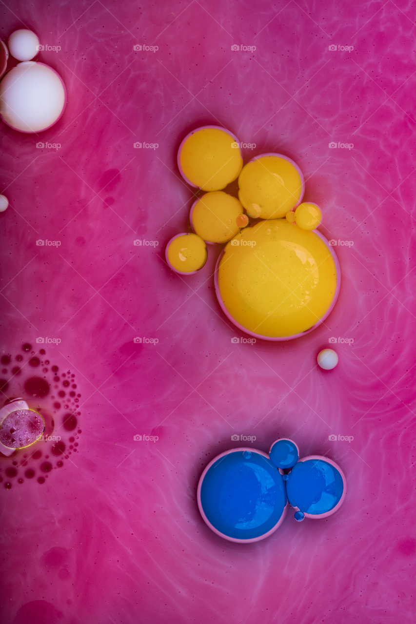 Mixed liquids like (color,oil,soap,milk) then photographing it by macro lens 100mm f2.8 lens