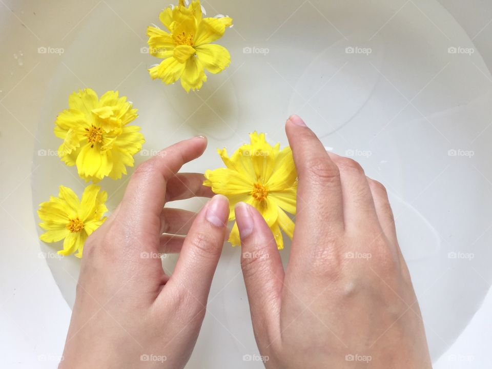 Hands with flowers , spa
