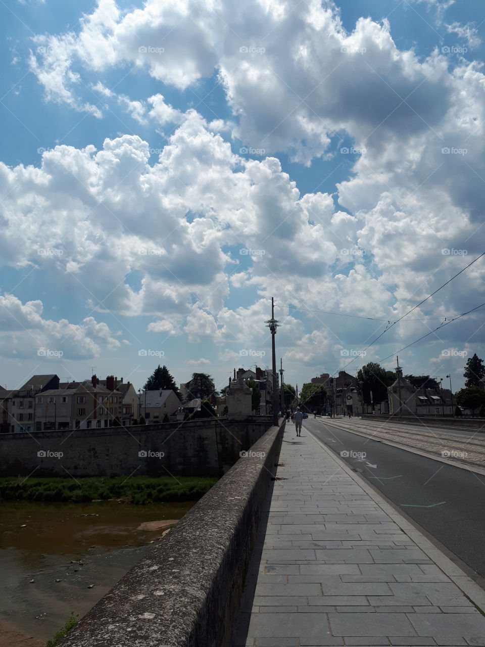 Man walks alone at the bridge