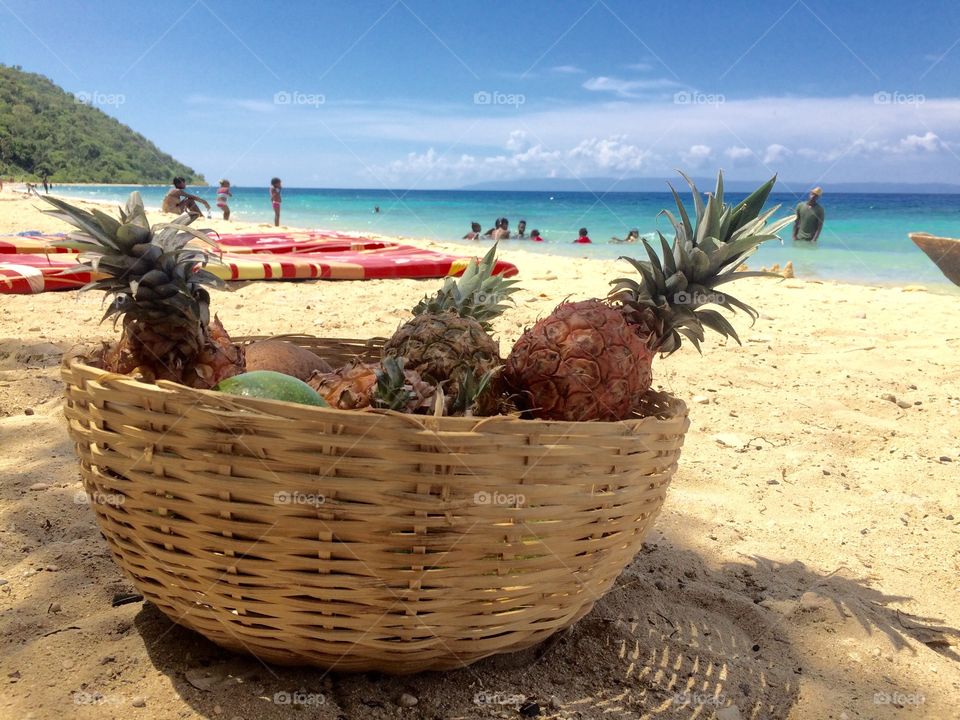 Pineapple Basket. This is a pineapple basket sitting on the beach of Haiti.