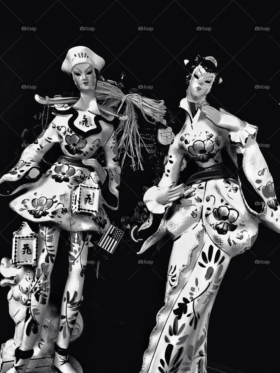 Two sassy Japanese porcelain dolls