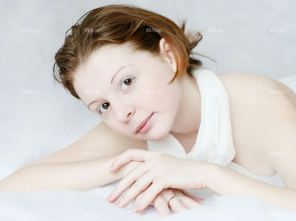 Portrait of red hair girl in white 