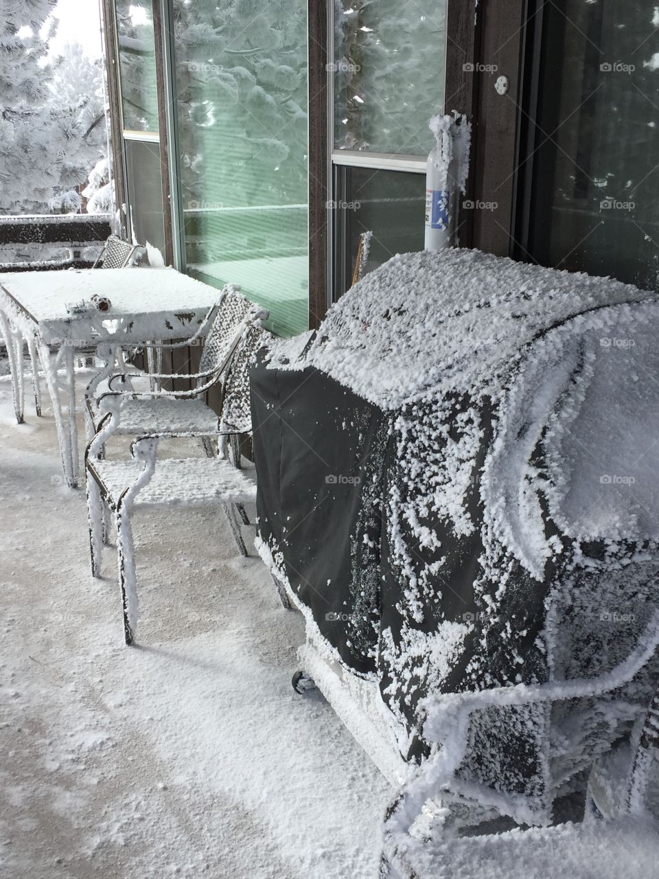 Frozen table and grill on patio