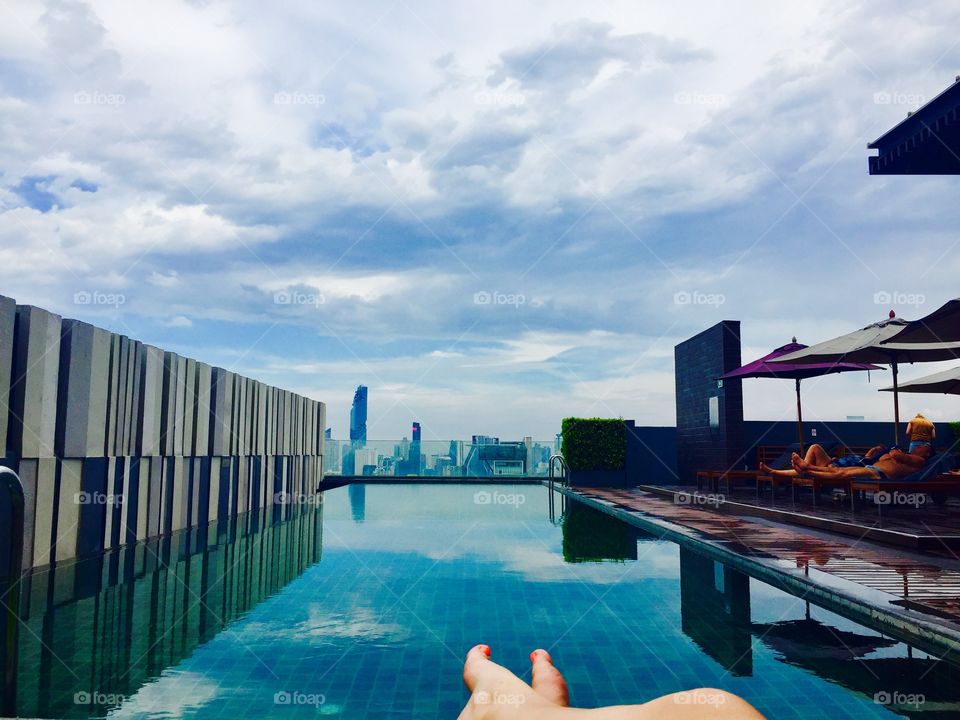 Relaxing at a rooftop pool in Bangkok