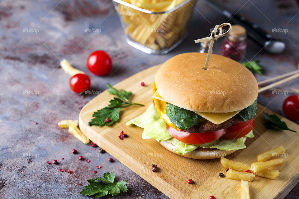 homemade burger with salad, cucumber, tomato and meat