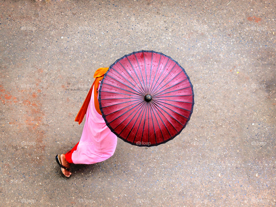 Beautiful Myanmar. The nun  with the pink umbrella