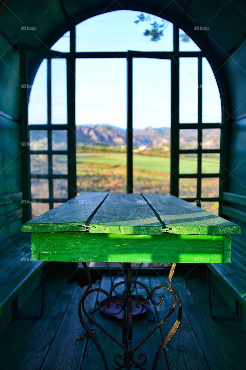 Old green empty table and seat