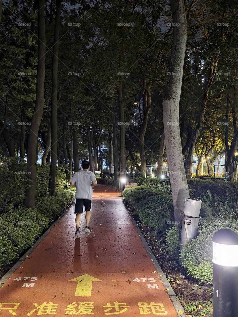 Night runner after the rain at Hong Kong Victoria Park