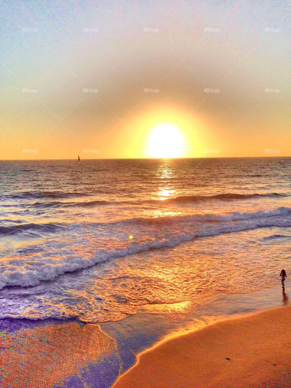 Waves at beach during sunset