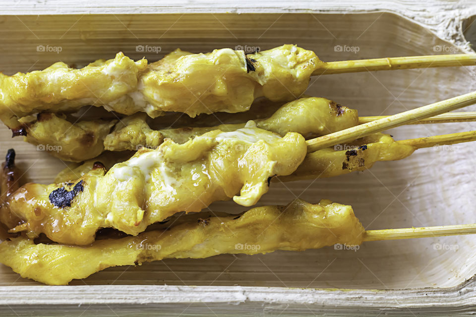 Pork Satay with coconut milk in bamboo.