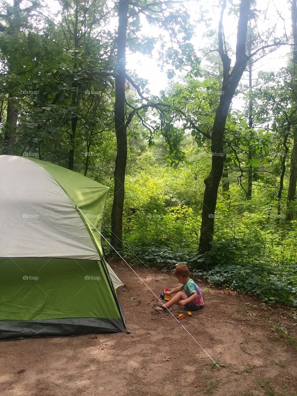 Vacation Camping Boy Playing by Tent