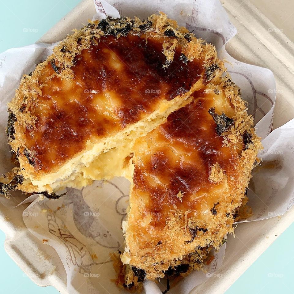 Homebaked pork floss sponge cake with salted egg sauce and cheese 