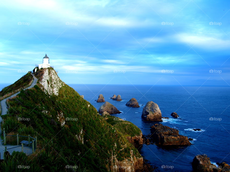 clouds over the Kaka point lighthouse, New Zealand