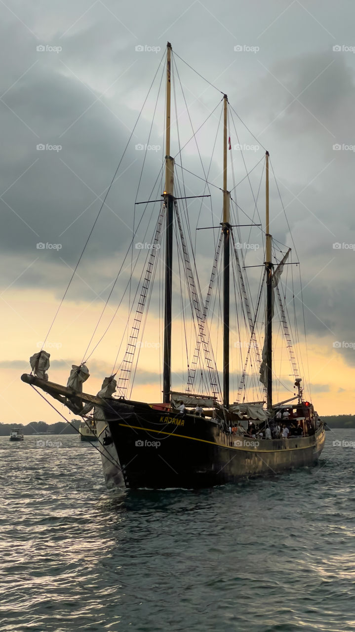 Talk sailing ship coming into the harbour 