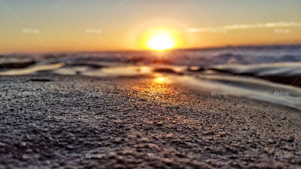 Close up of Rocky Shore with sun setting