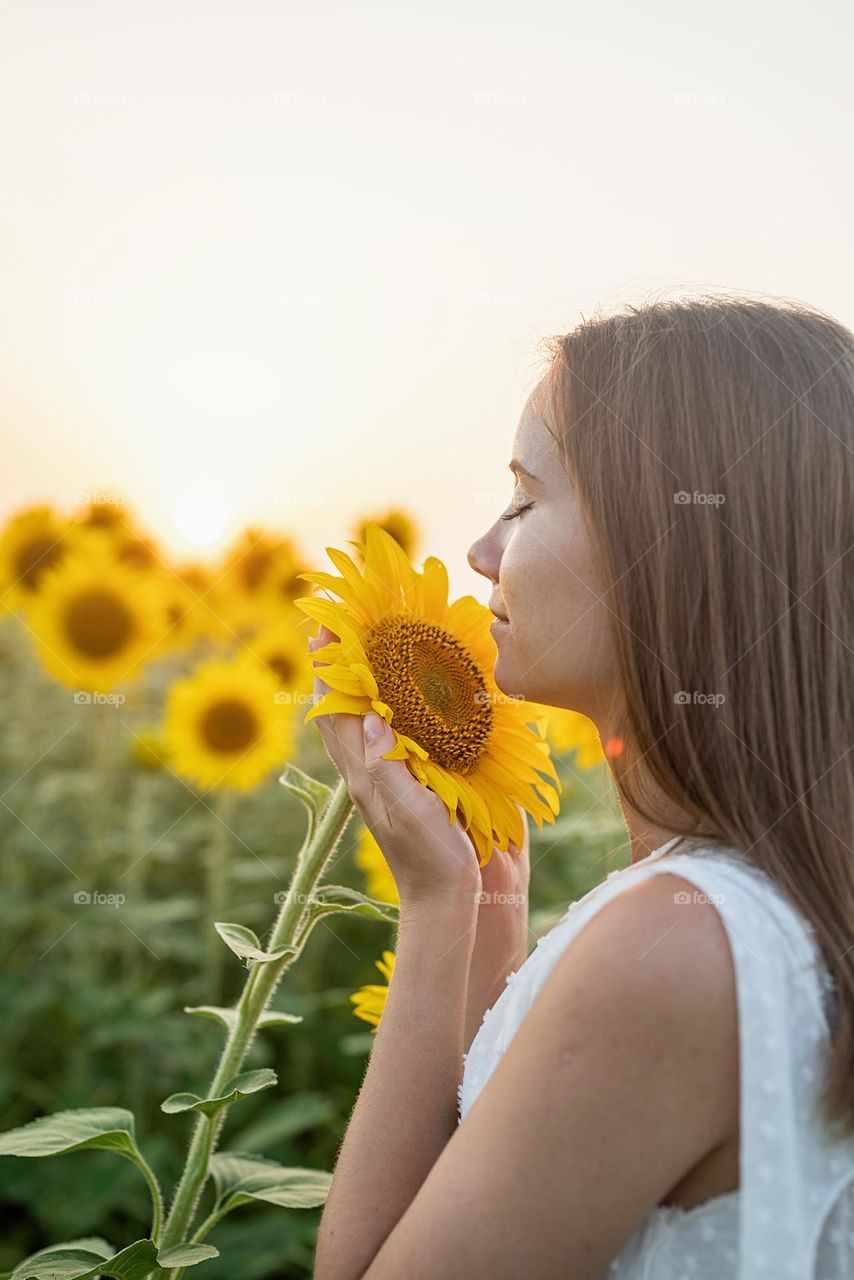 woman in sunflower field