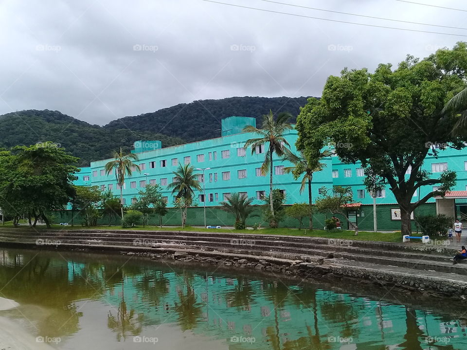 Green hotel and river at beach