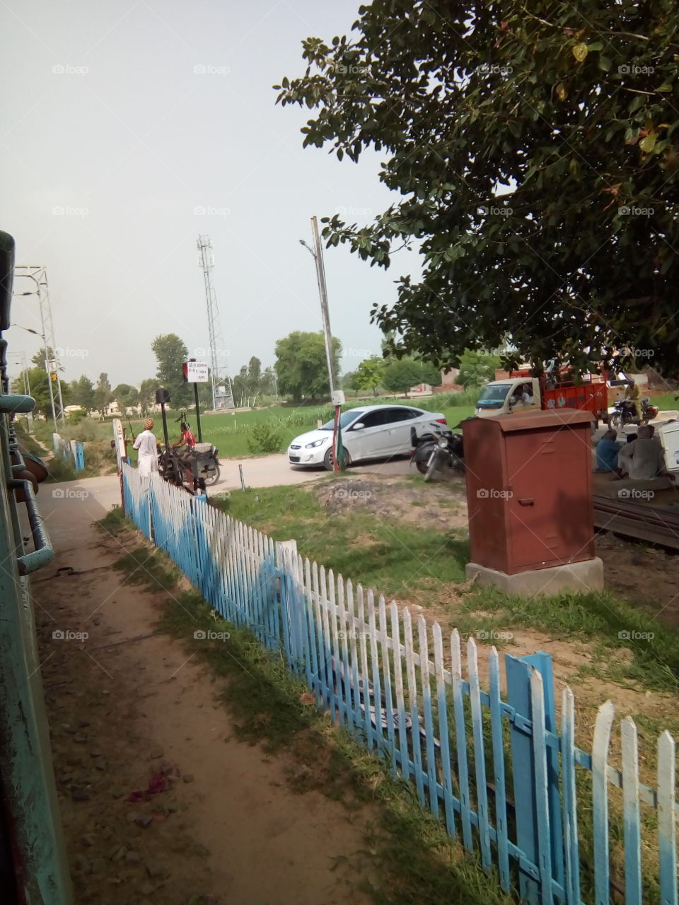 natural beautiful seen of a village in India- railway crossing.