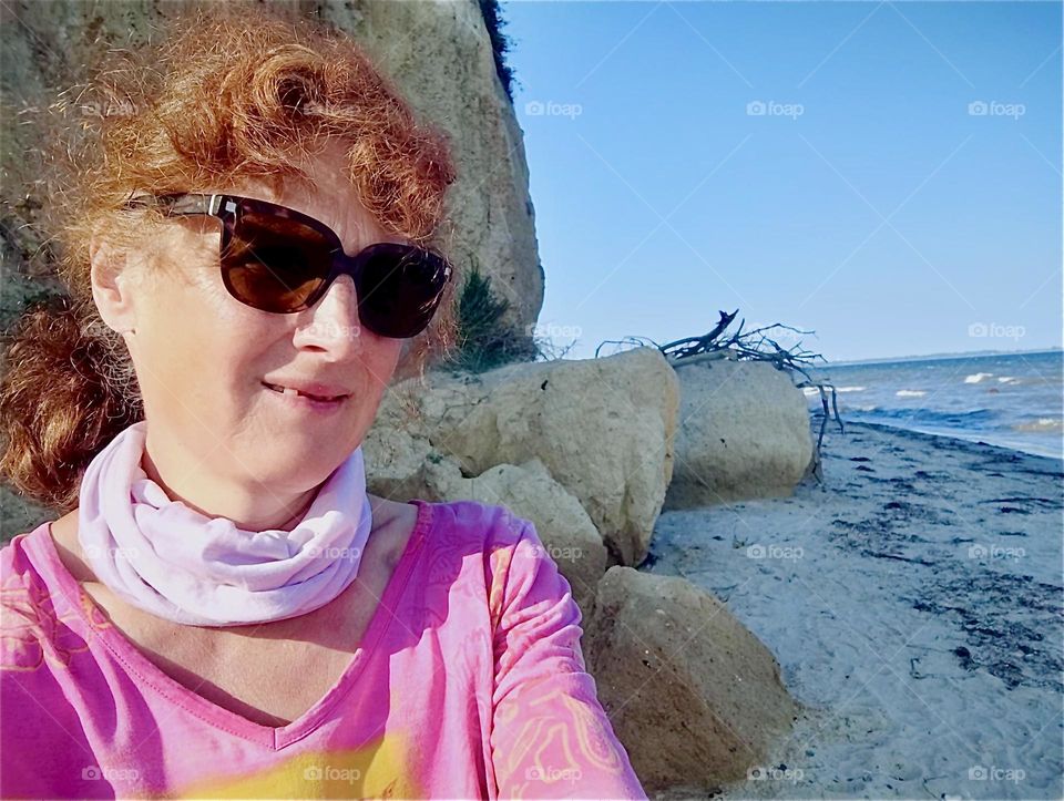 This is once again our lovely traveling lady on the shore of the island “Hiddensee” in the “Baltic Sea” or “Ostsee” in “Mecklenburg - Western Pomerania”, Germany on a bright sunshiny day in August 2024. Hypnotic Productions