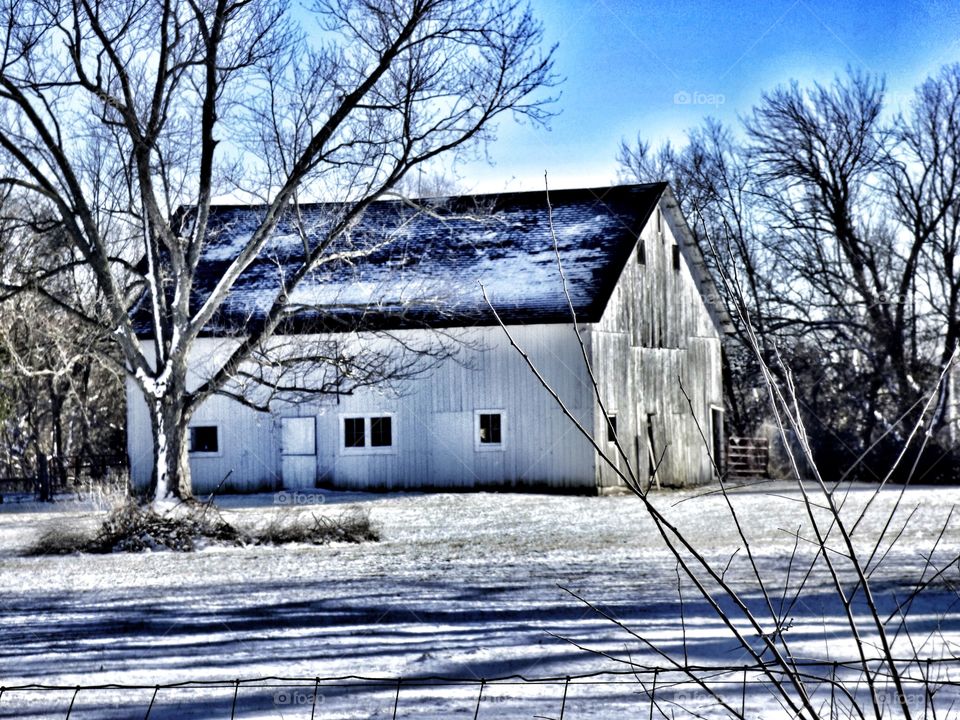 Rustic old snowy barn 