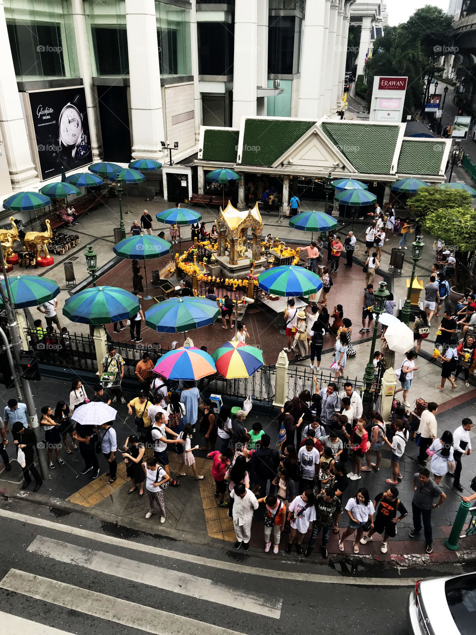Bangkok, Thailand – July 26, 2018 : A photo of The Erawan Shrine, formally the Thao Maha Phrom Shrine in Ratchadamri road, view from top of the Thai Skytrain (BTS). 