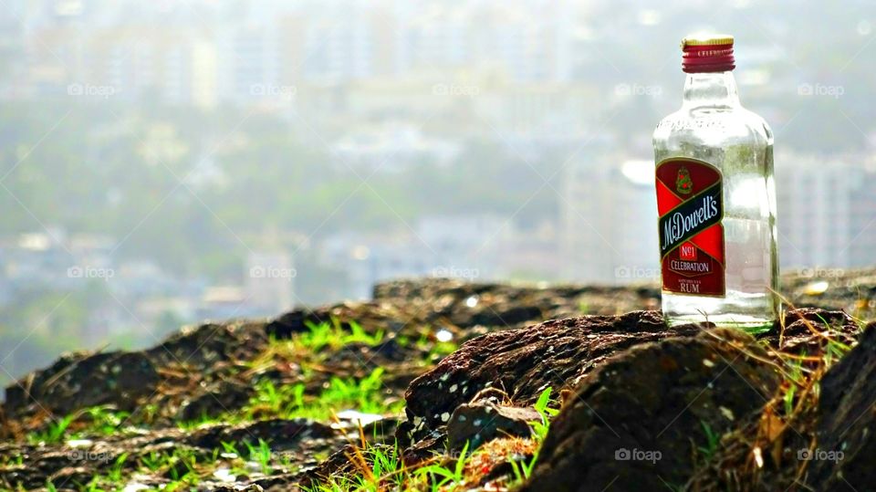 Mc'donals the bear bottle fully empty.
Stone with empty bottle of Rum.
Drink 
#madonals #drink #bear #rum
This picture shows the way to drink and throwing of bottle any where.
This scean is captured on the mountain,
here this bottle is present empty.
Any drinked person had throw here.
This works like energy drink for those who is regular in that.
www.autoedits.com
#autoedits
#av #editor
#photography