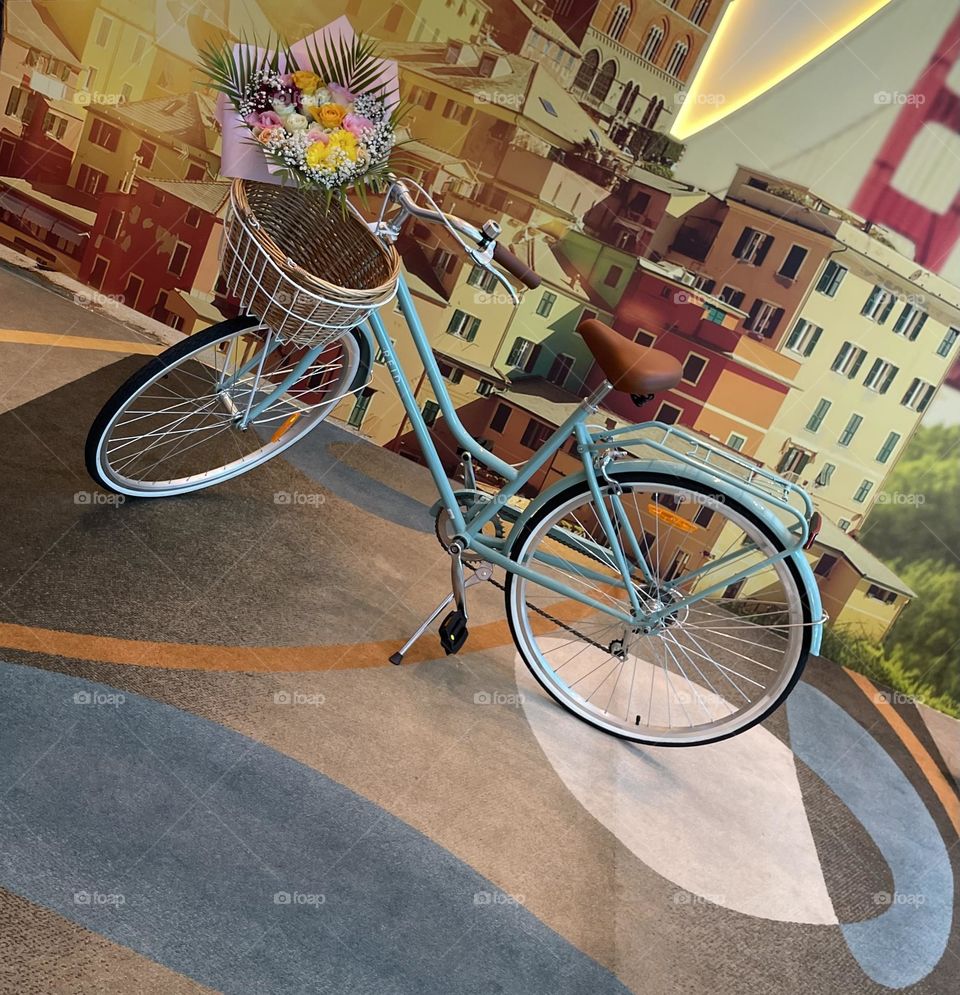 Bluish bicycle with flowers 