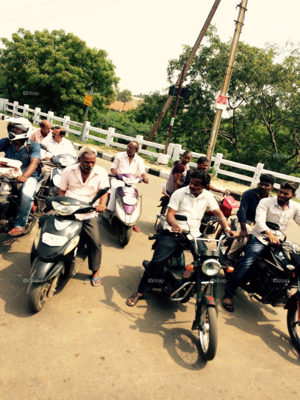 People with motorbike on street