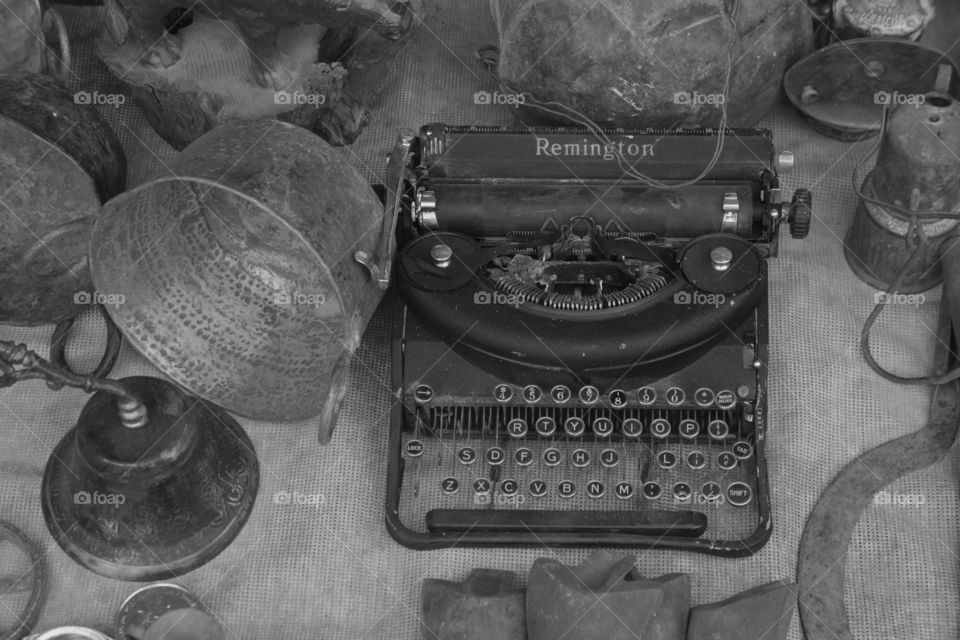 A vintage Remington brand typewriter being sold along with other old items at a flee market in San Miguel de Allende, Mexico.