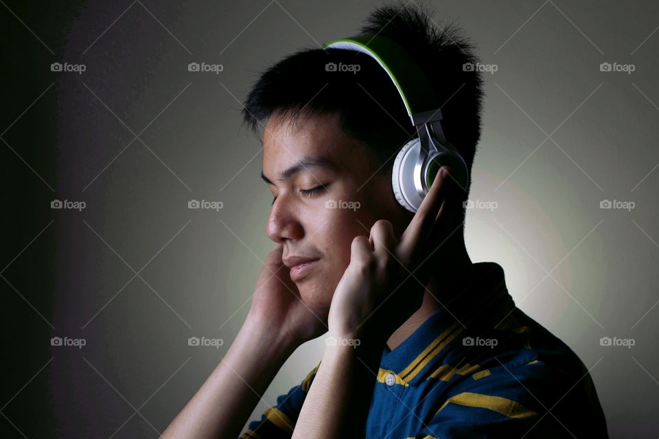 male teenager with headphones