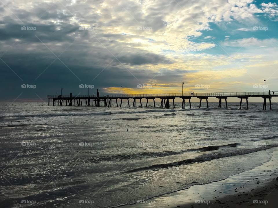 Peer jetty public wharf at sunset golden hour south Australia Adelaide Glenelg 