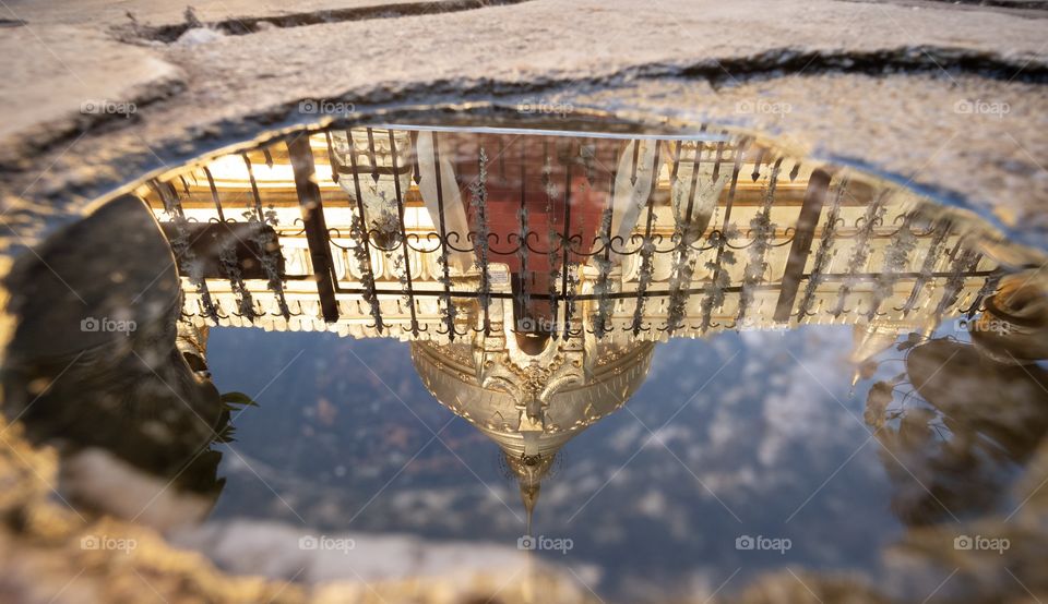 Wisdom of human to make a small Puddle like eye shape to show beautiful reflection of Shwezigon Pagoda when visitors want to see top of pagoda in a Sunny day