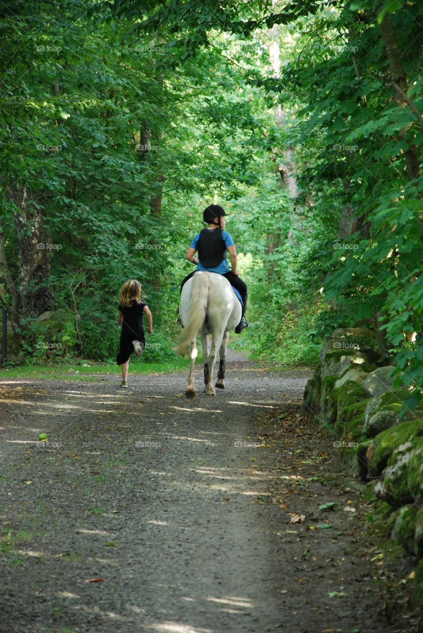 Boy riding horse