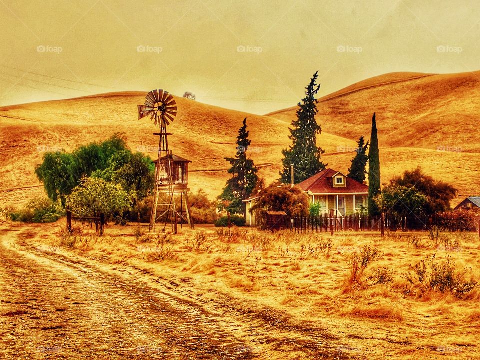 Country home with old fashion windmill 