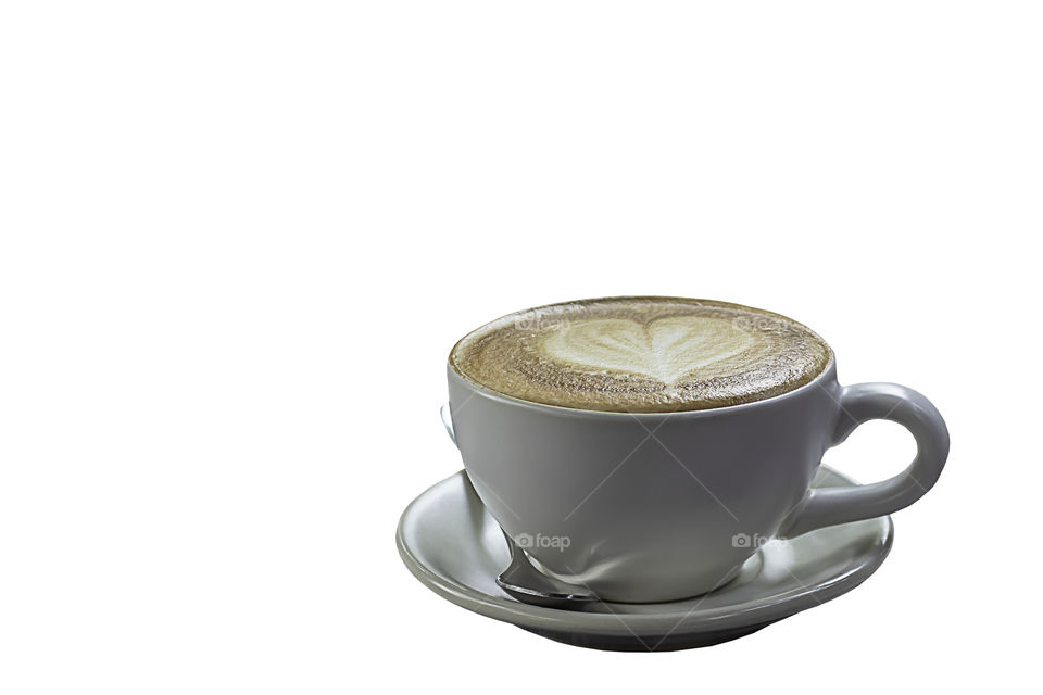 Hot coffee Espresso topped with a heart-shaped milk in white glass on a white background with clipping path.