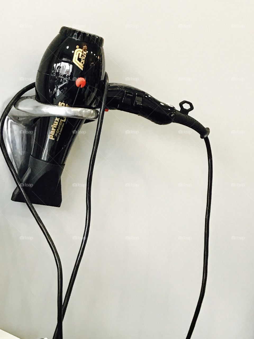 Hairdressers-hairdryer-hanging 