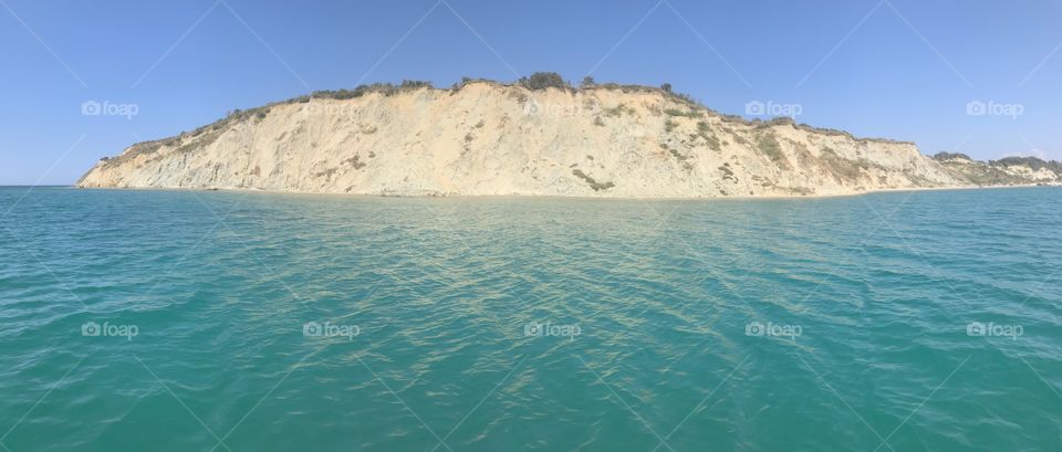 The blue waters and barren hills of Durres