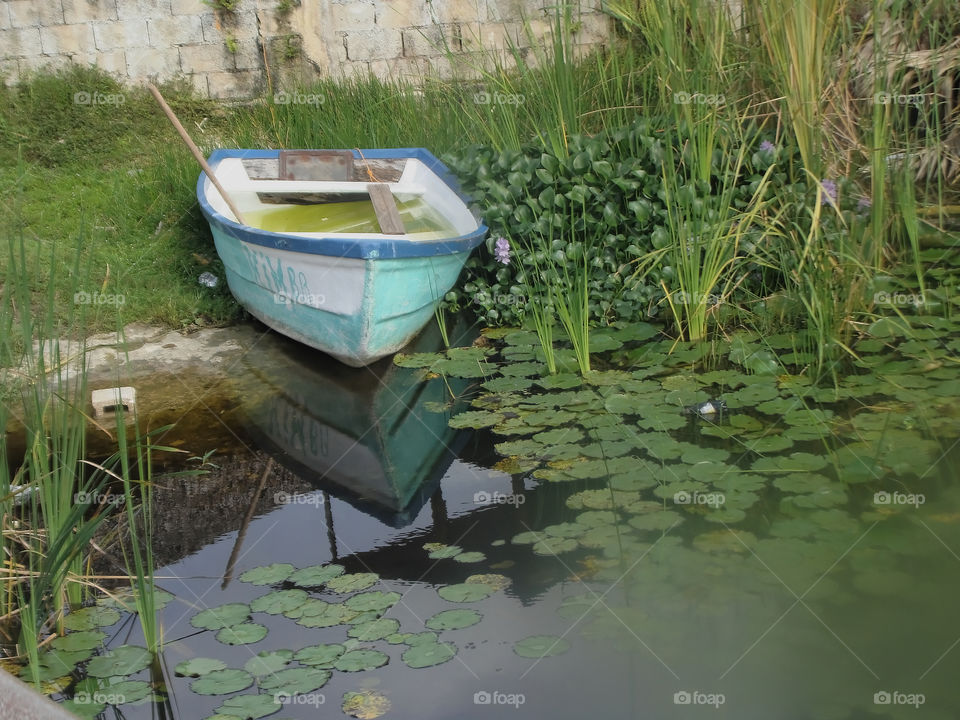 Empty Boat Docked at River