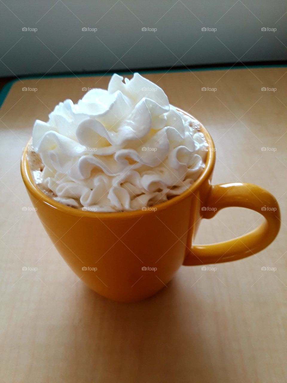 Vanilla Cappuccino With Whipped Creme In Yellow Mug, Coffee Shop