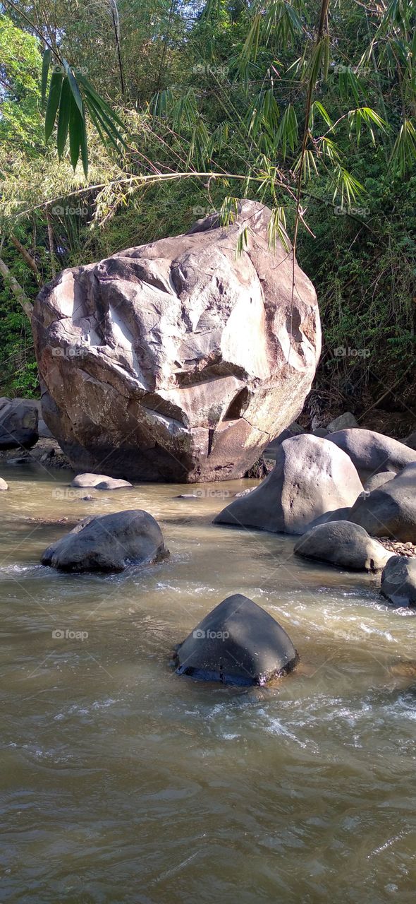 This big rock is in the middle of the river
