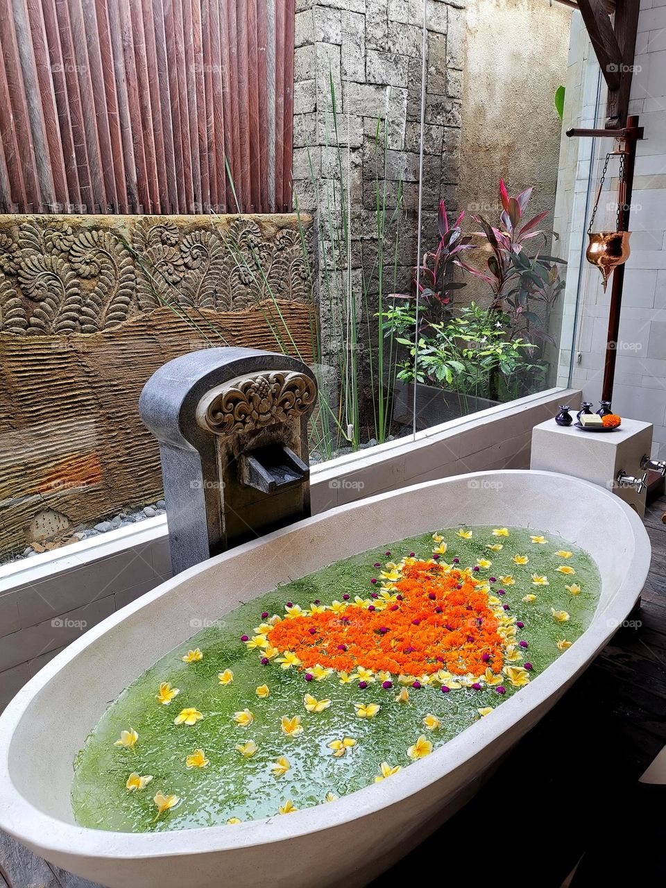 Beautiful bath with flowers. Bali experience. Relax time. Enjoy bath time.
