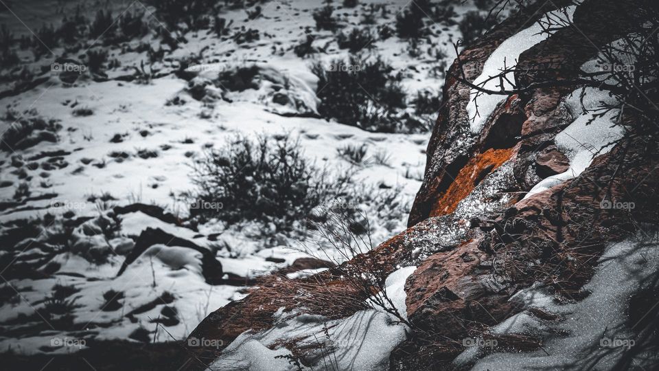 Dirt foreground of snowy plains.