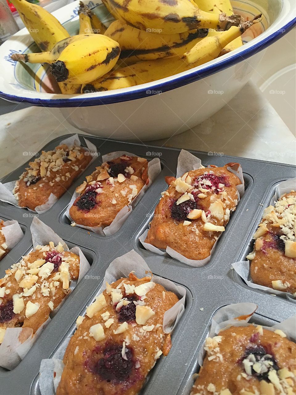 Homemade banana mulberry mini bread loaves with macadamia nut topping