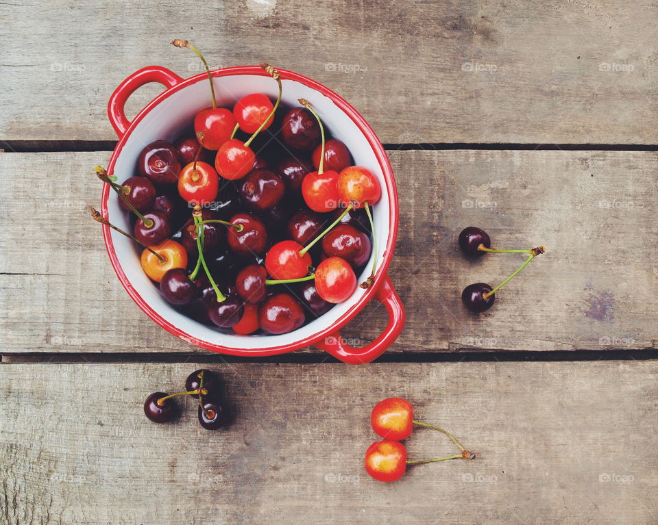 High angle view of cherries in bowl on table