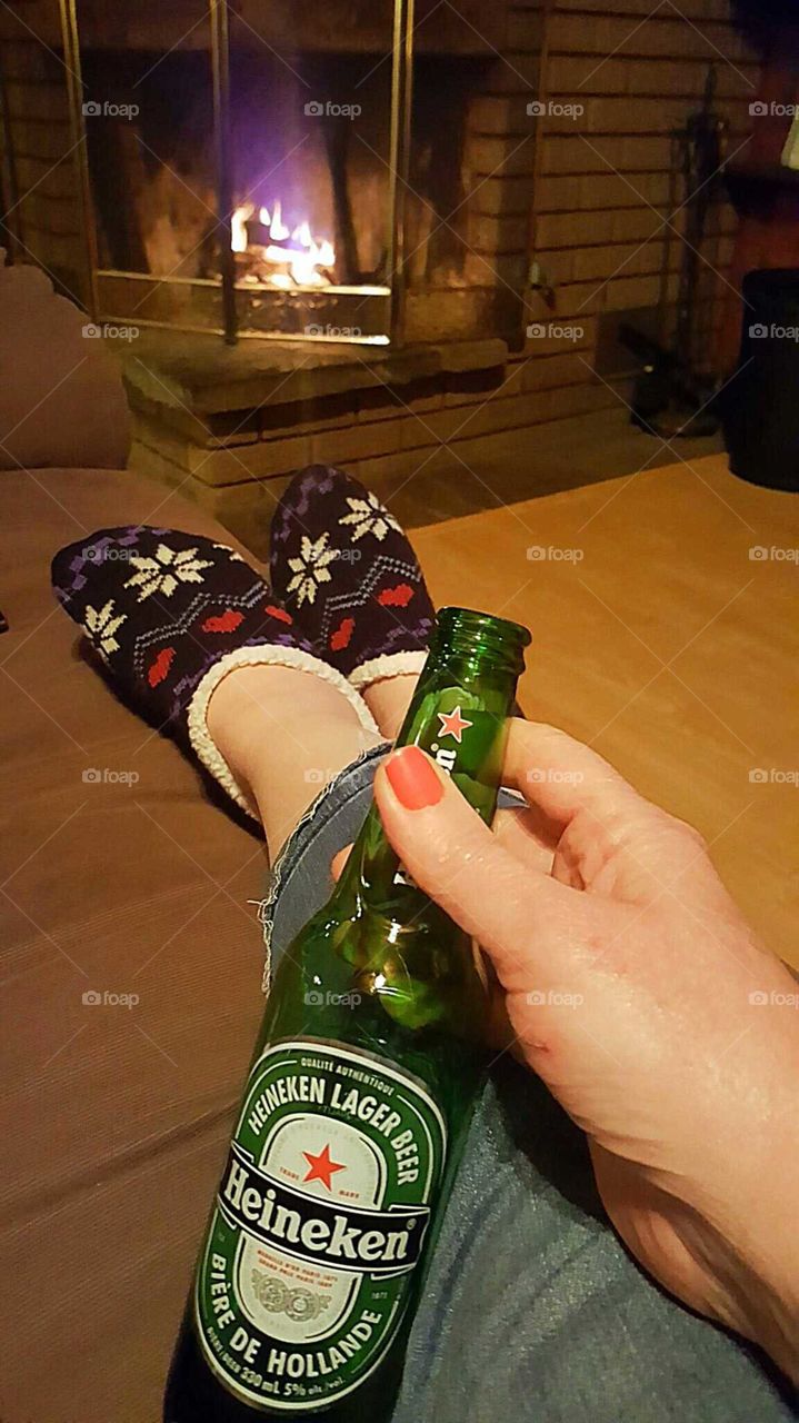 Heineken by the fireplace