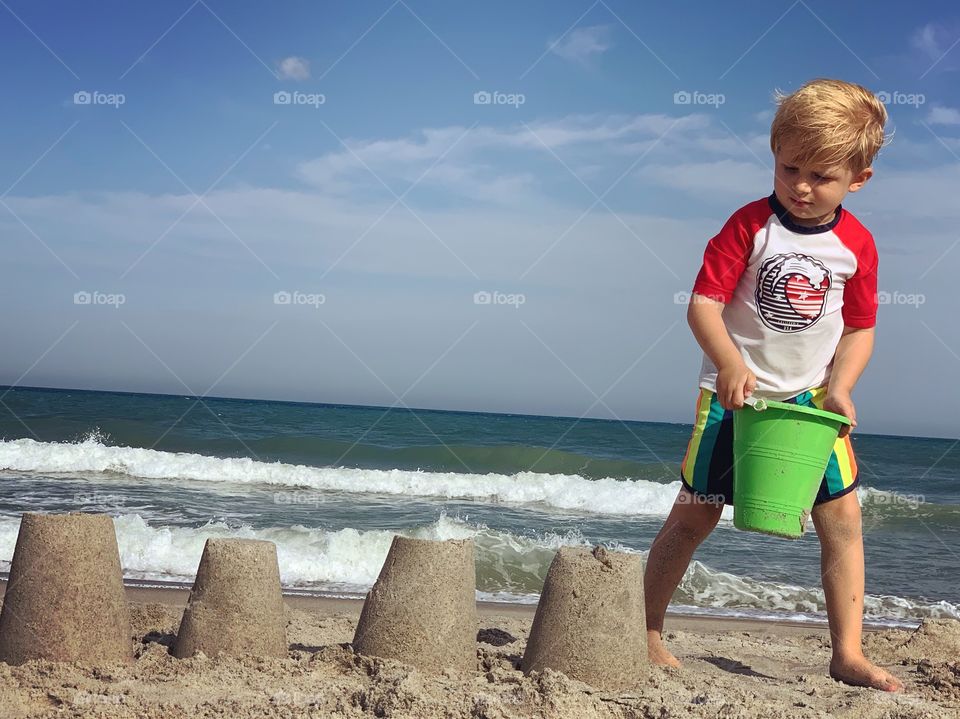 Little boy playing on beach 