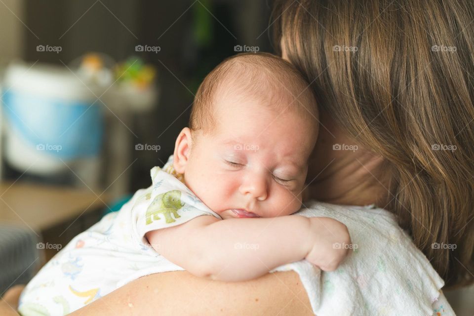 beautiful mother and six-month-old son, tender family photos, family spending time at home